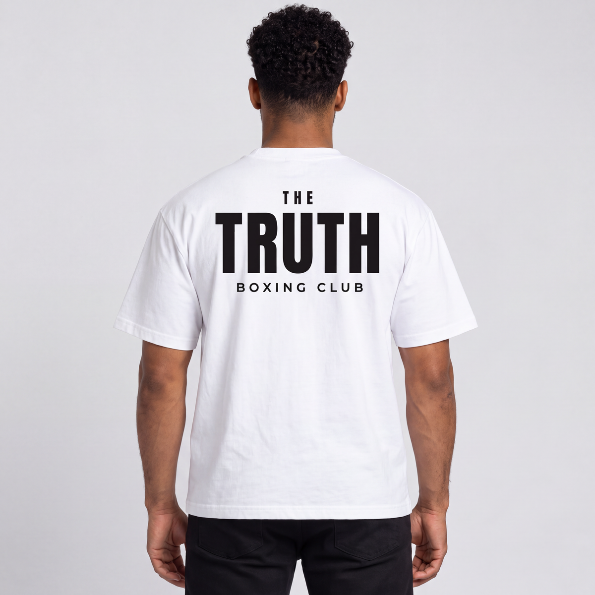 Back view of The Truth Boxing Club white tee with large black club wordmark.